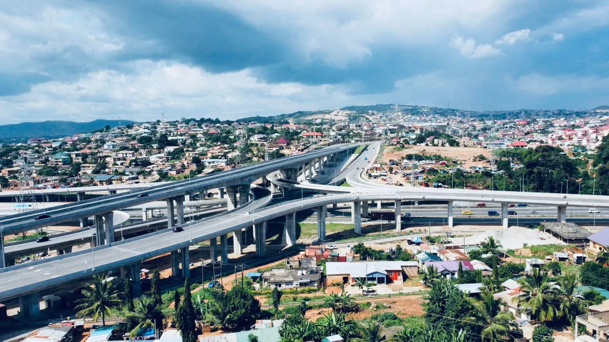 Aerial view of a highway interchange and neighbourhoods in Greater Accra, Ghana